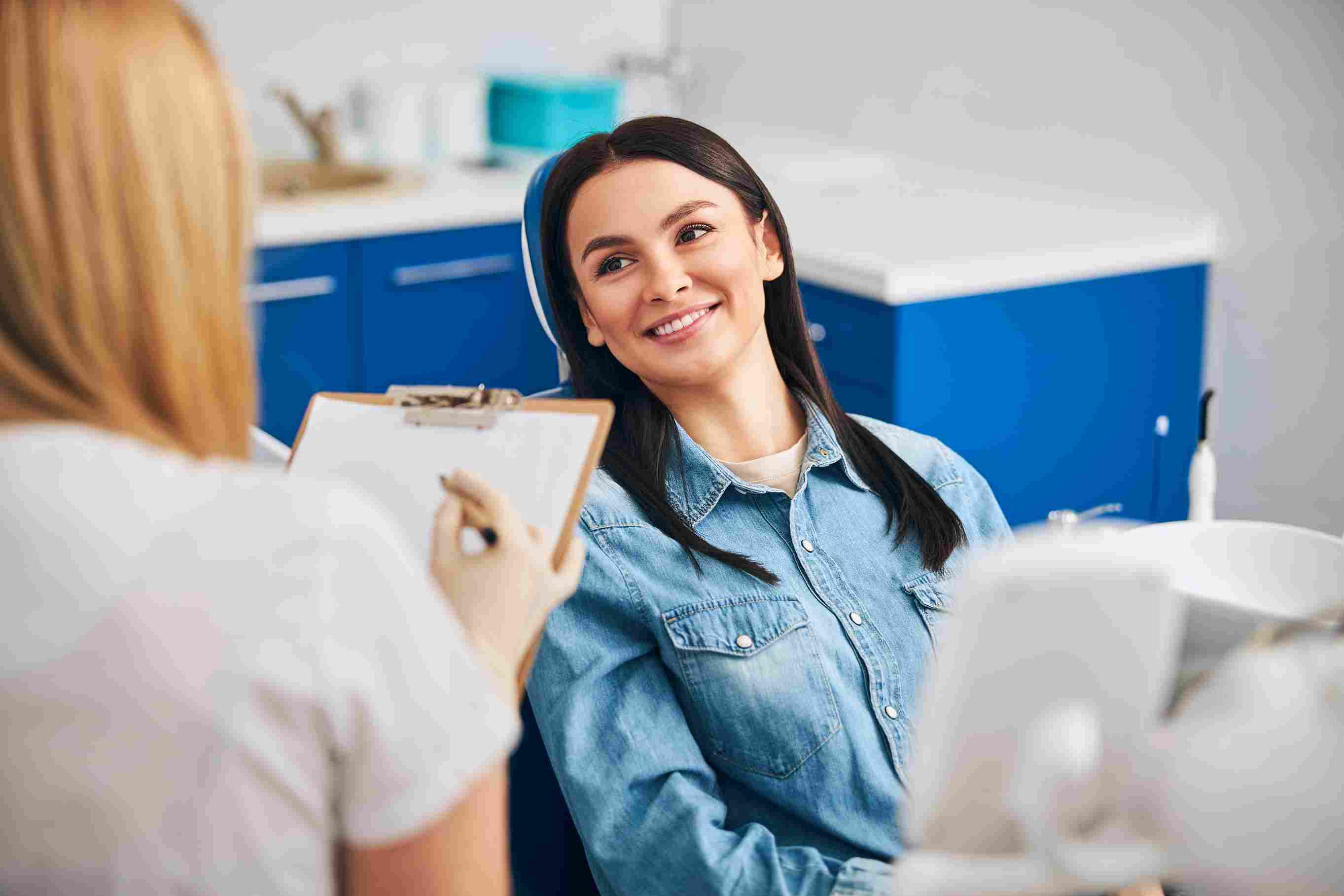 woman-smiles-during-dental-appointment-with-dentis-2026-03-19-10-40-17-utc_11zon